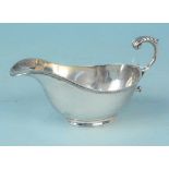 A silver sauce boat with pedestal base, ribbed edge design, hallmarked Sheffield 1932,