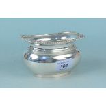 A large silver sugar bowl with shell decorated border, hallmarked Birmingham 1966,