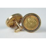 A pair of 9ct gold cufflinks, each set with a sovereign,