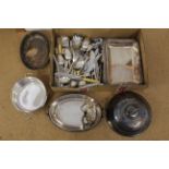 A box of mixed silver plated items including cutlery and tureens