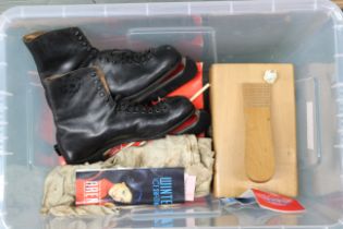 A box containing a vintage boxed boot polishing set,
