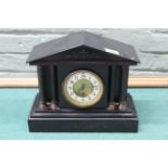 An early 20th Century black marble mantel clock (pendulum and key present)