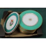 A set of twelve late 19th Century porcelain plates with green borders and gilded decoration plus a