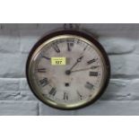 A mahogany round dial wall clock, face marked 'Bristol', with key,