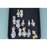 A collection of twelve varying size ceramic half dolls