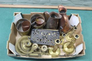 A box of brass and copper wares including candlesticks,