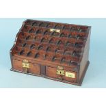 An Edwardian mahogany public house till/coin rack,