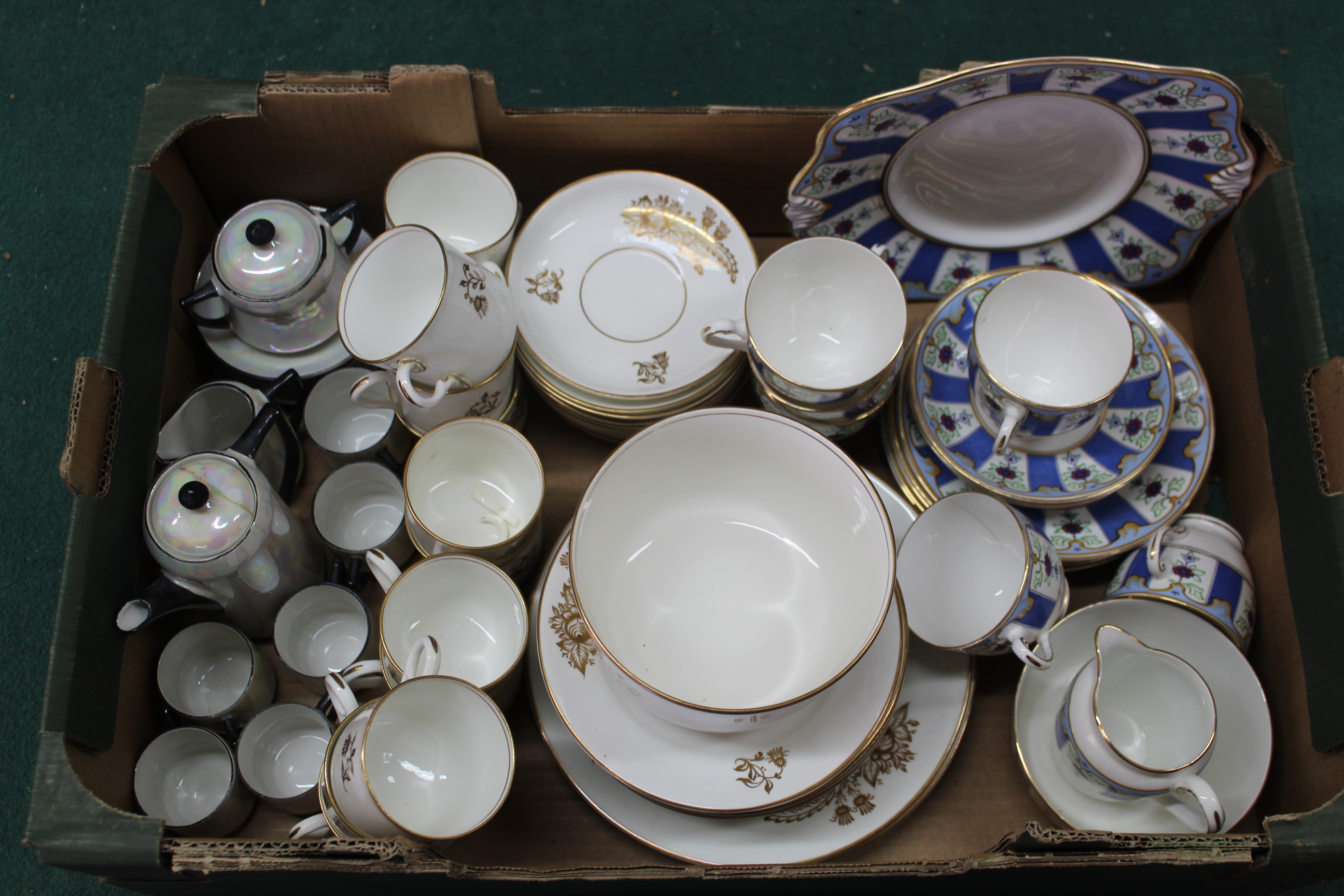 A box of mixed tea sets including Tuscan china, an extensive Victorian white and gilt set,