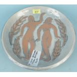 A Studio pottery dish of two dancing figures in high relief with palm leaves
