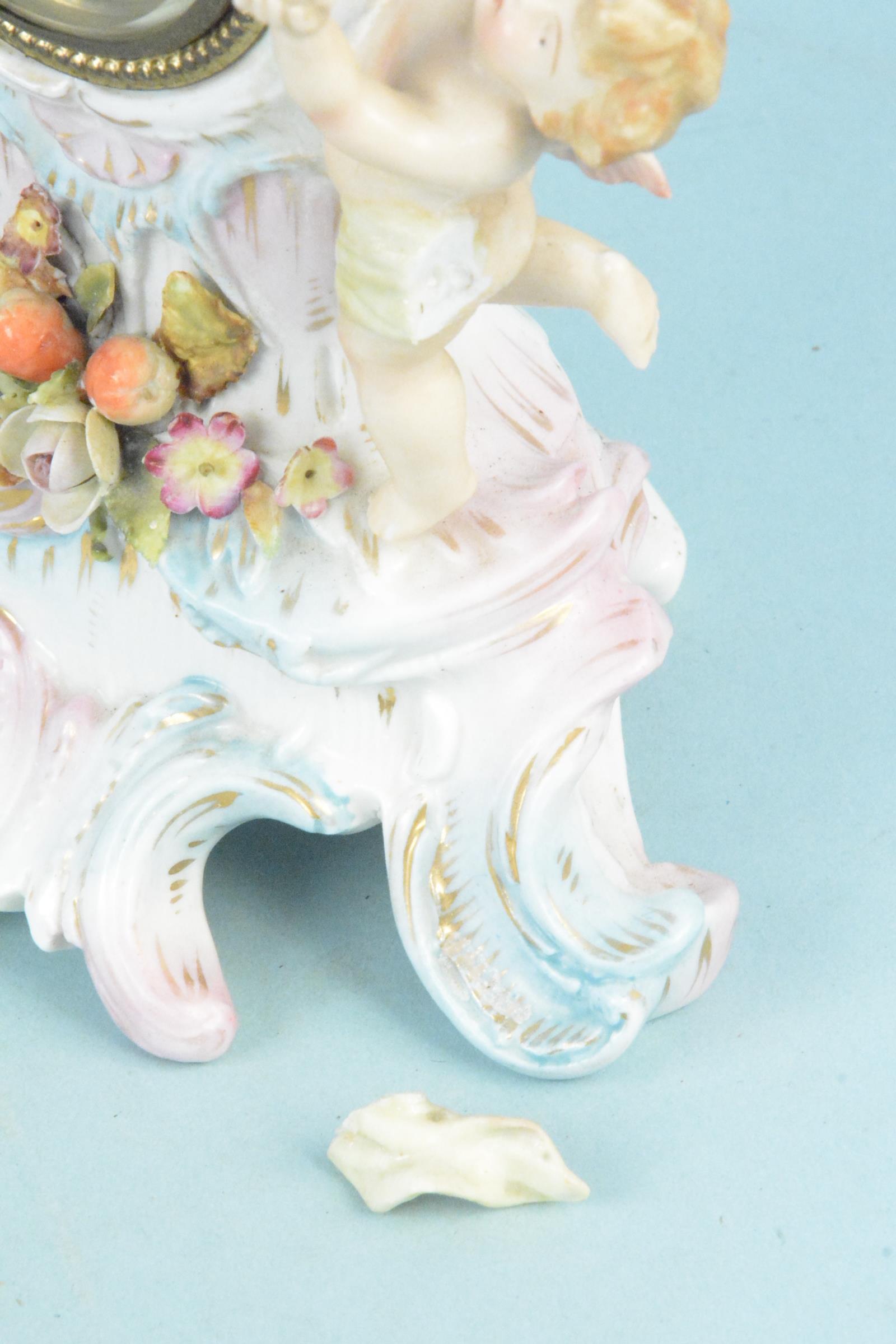 A continental porcelain cherub decorated mantel clock (as found to one cherub), - Image 4 of 4