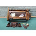 An early 20th Century pine and walnut cased Vienna wall clock