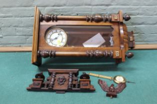 An early 20th Century pine and walnut cased Vienna wall clock