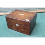 An antique mahogany dressing table/sewing box inlaid with mother of pearl and silver plated jars