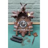 A Black Forest carved wooden cuckoo wall clock