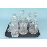 Seven cut glass decanters,