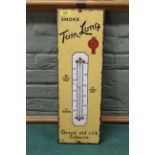 A vintage enamel on metal advertising sign for 'Tom Long Tobacco' with thermometer