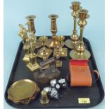 Mixed metalware including four pairs of candlesticks, a small box iron,