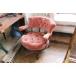 A late Victorian tub chair with ebonised and gilt frame