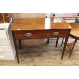 An early 19th Century mahogany two drawer writing table