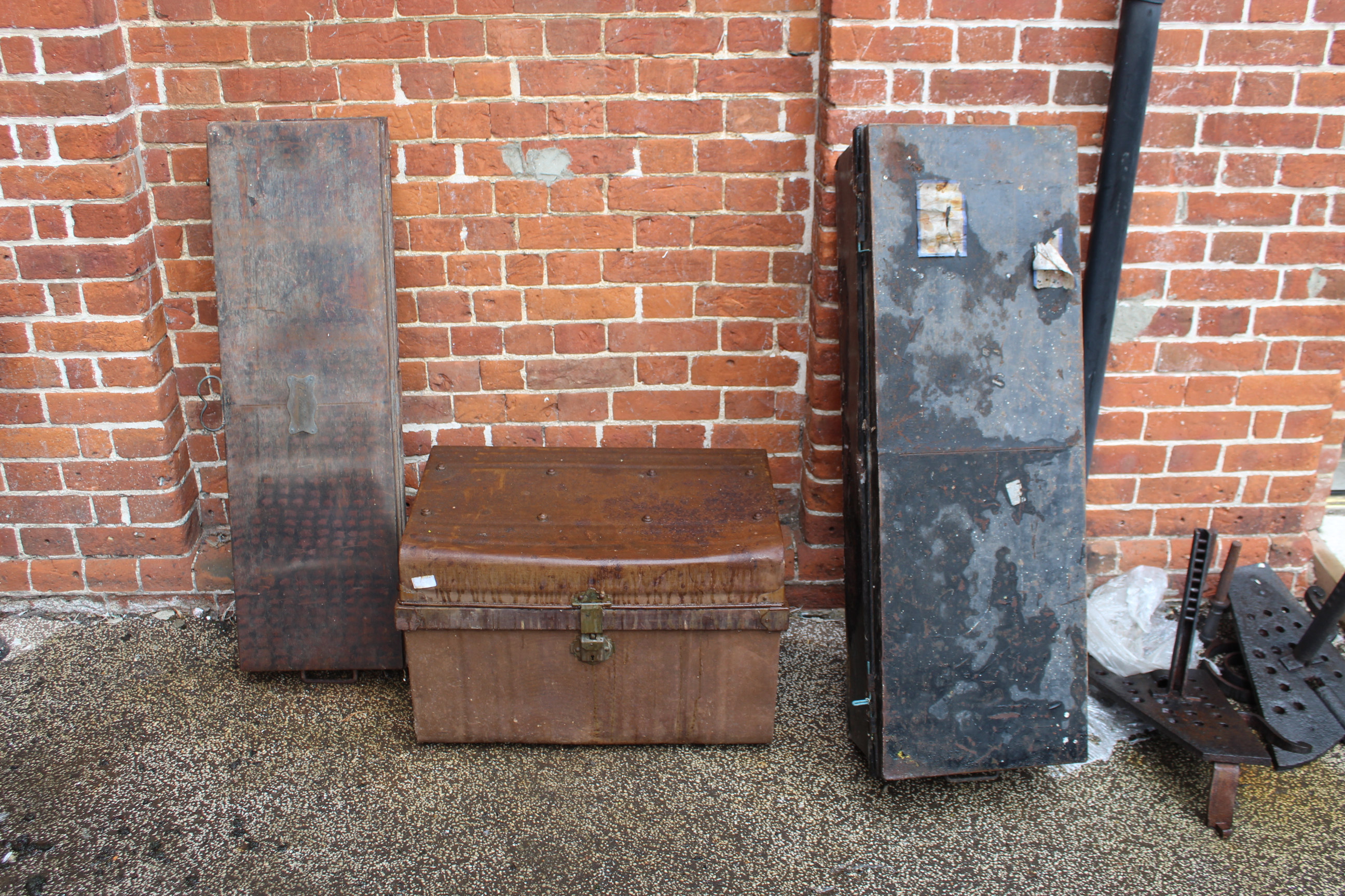 Three vintage metal storage trunks