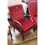 A mahogany framed Regency style open armchair on reeded sabre legs