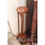 A Victorian style mahogany plant stand