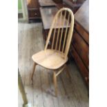 A blonde beech and elm stick back dining chair