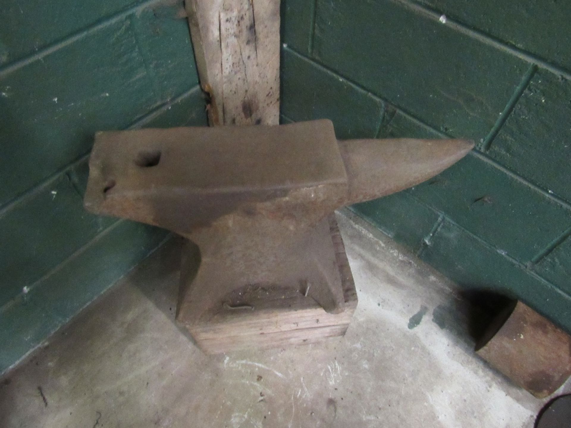 Anvil on wooden block