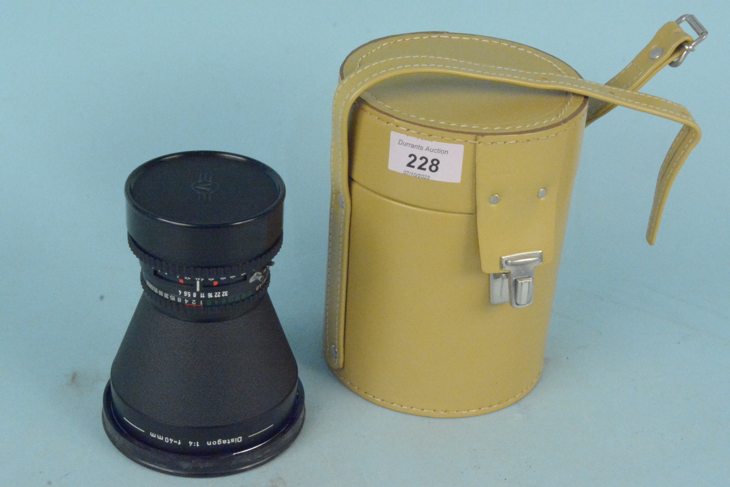 A Hasselblad Distagon 1:4 40mm cased camera lens