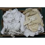 A box of mixed mainly antique linen nightshirt's and child size clothes