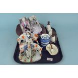 A pair of Staffordshire style figurines of a couple with cows, a Carlton ware cruet,