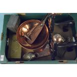 A box of mixed metalware including cast iron and copper fire dogs, brass and copper lidded boxes,