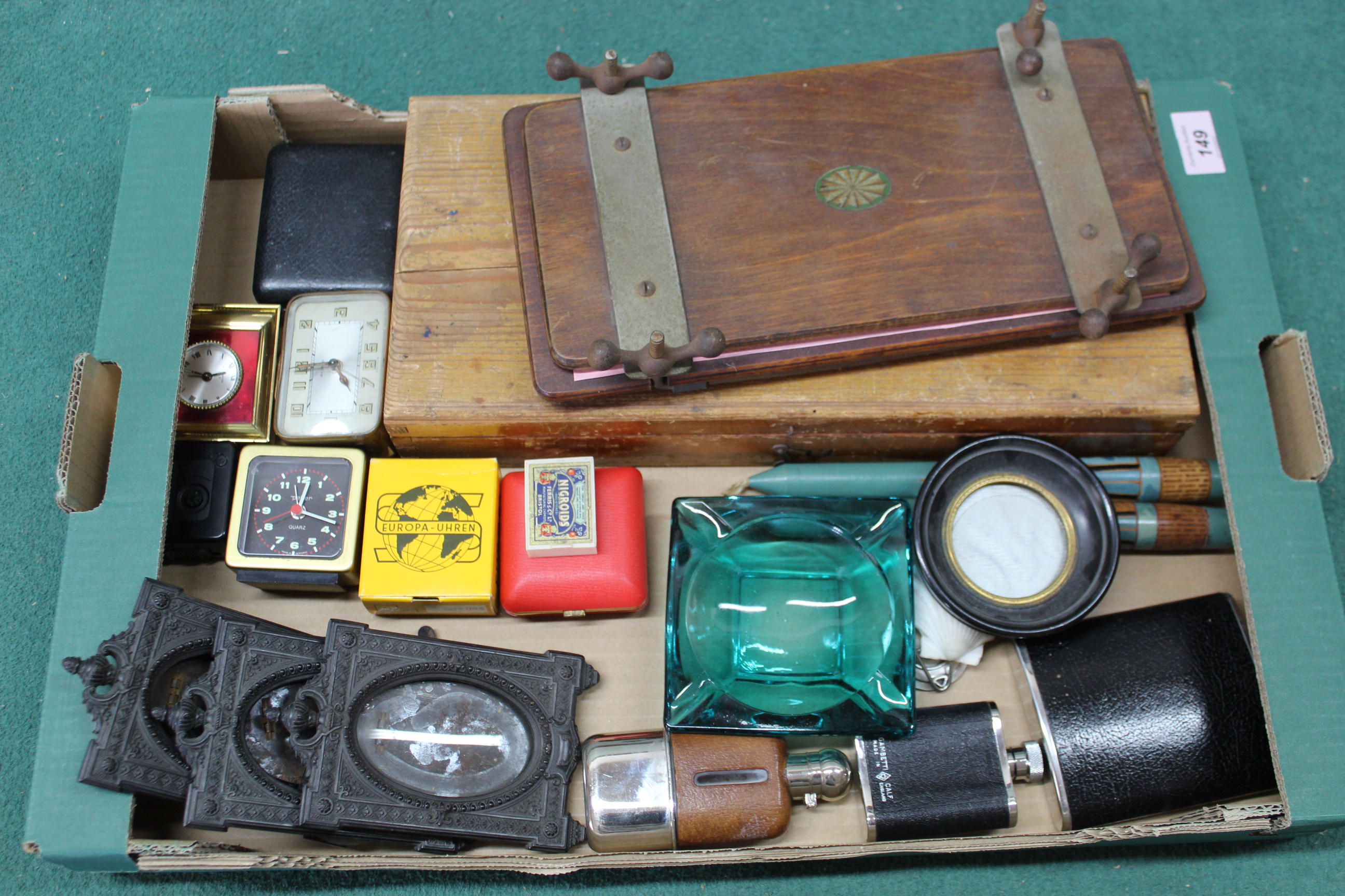 A box of mixed items including three Victorian picture frames, bedside clock,