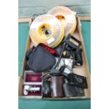 A box of photographic accessories including a vintage Kodak camera