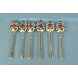 An unusual set of six silver gilt enamel decorated teaspoons,