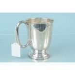 A silver tankard on stepped flared base, hallmarked Sheffield 1945, maker Roberts & Dore,
