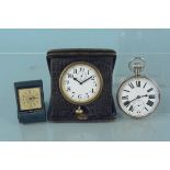 A metal cased enamel dial Goliath pocket watch together with two cased desk travel clocks