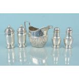 Four silver cruet items plus a silver cream jug of ribbed design (rubbed marks),