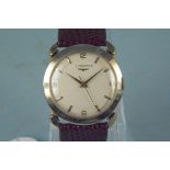 A c1960's gents Longines 14K gold wristwatch with fancy lugs,