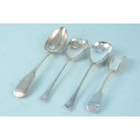 A pair of silver salad servers, a silver scoop, an Irish silver spoon (as found),