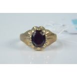 A gents 9ct gold oval garnet set ring, size Q, weight approx 6.