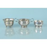 Three silver bowls including a twin handled example, various dates and makers (two dented),