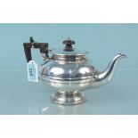 A Walker & Hall silver teapot of bulbous shape with garland edge detail to top and base,