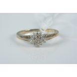 A 9ct gold diamond cluster ring, size L 1/2, weight approx 1.