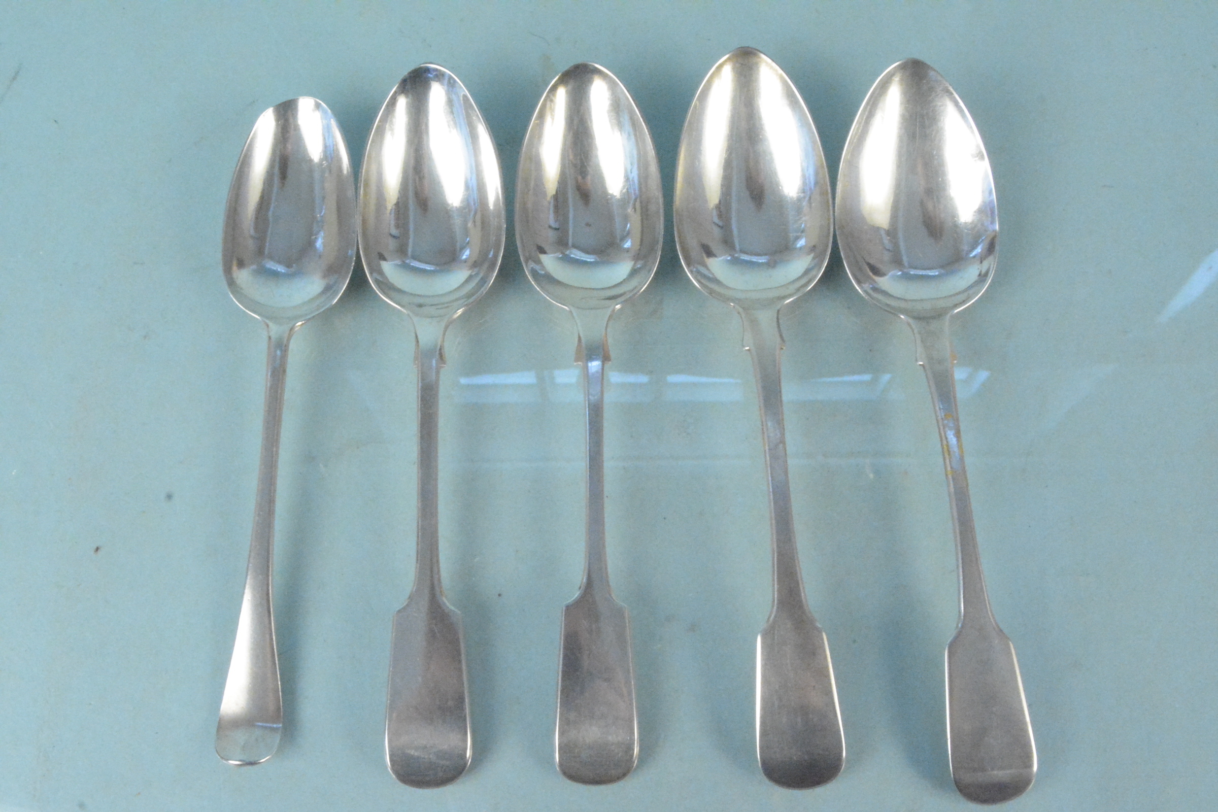 Five silver serving spoons including a pair of Georgian,