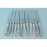 A set of twelve silver handled table knives, hallmarked Sheffield 1979,