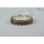 A 9ct gold six stone garnet set ring, size O, weight approx 2.