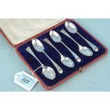 A cased set of six silver teaspoons, hallmarked Sheffield 1902, maker Sydney & Co,