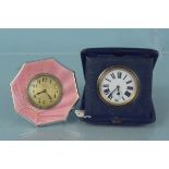 A silver enamelled early 20th Century desk clock together with another cased desk clock