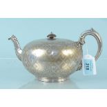 A Victorian engraved silver teapot, hallmarked London 1863, maker Robert Harper (heavily dented,